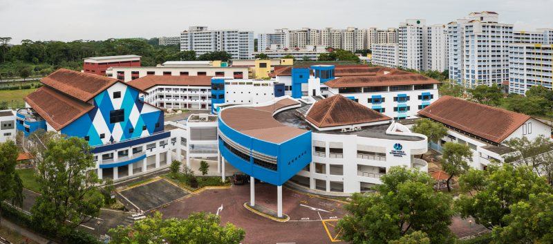 One World International School Singapore — campus aerial view with school building and grounds